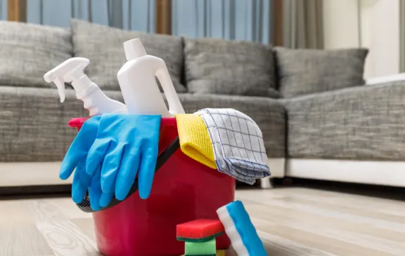 Cleaning service. Bucket with sponges, chemicals bottles. Rubber gloves and towel. Household equipment